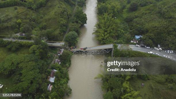 An aerial view of the collapsed El Alambrado bridge over the La Vieja River that connects the departments of Quindio and Valle del Cauca on April 13,...