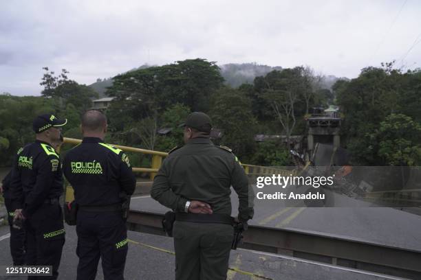 Police officers deployed at the scene after a bridge across the La Vieja River connecting the departments of Valle del Cauca and Quindio in Colombia...