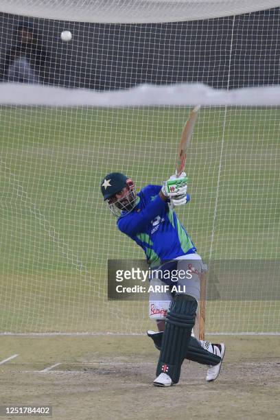 Pakistan's captain Babar Azam bats during a net practice session at the Gaddafi Cricket Stadium in Lahore on April 13 ahead of the first T20 cricket...