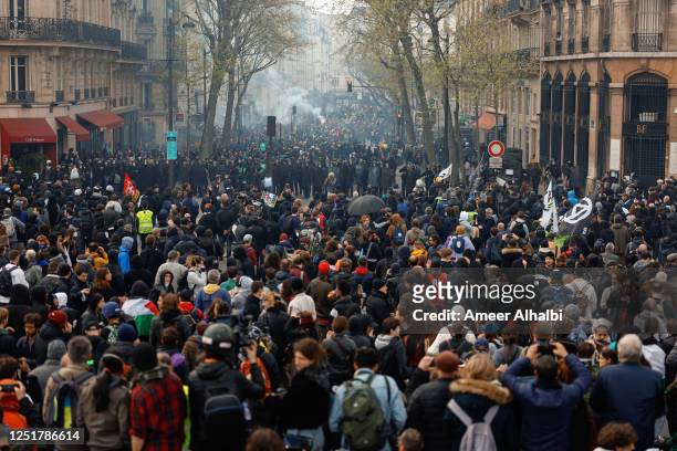 People demonstrate on the streets for the 12th day of nationwide strikes amid protests against pension reform on April 13, 2023 in Paris, France....