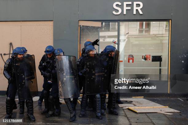 Clashes between police and protesters on April 13, 2023 in Paris, France. Labour unions and activist groups continue actions to protest France's...