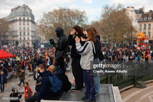 People demonstrate on the streets for the 12th day of nationwide strikes amid protests against pension reform on April 13, 2023 in Paris, France....