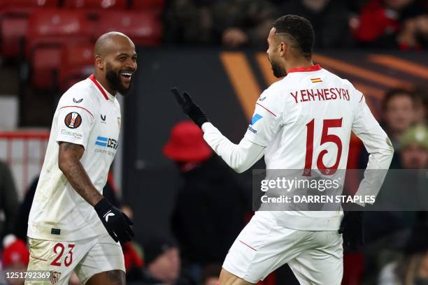 Sevilla's Moroccan forward Youssef En-Nesyri celebrates scoring the team's second goal with Sevilla's Brazilian defender Marcao during the UEFA...