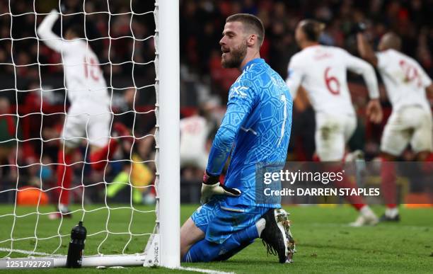 Manchester United's Spanish goalkeeper David de Gea reacts after conceding a second goal during the UEFA Europa league quarter-final, first leg...