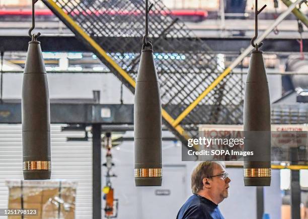 Shells hanging move along a conveyer belt while drying. The Scranton Army Ammunition Plant held a media day to show what they make. The plant makes a...