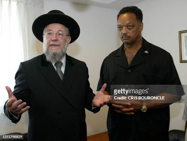 Ashkenazi Chief Rabi Yisrael Meir Lau folds his arms as US Reverend Jesse Jackson looks on prior to their meeting at Lau's offices in Jerusalem 30...