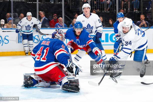 Jaroslav Halak of the New York Rangers makes a save against Auston Matthews of the Toronto Maple Leafs at Madison Square Garden on April 13, 2023 in...