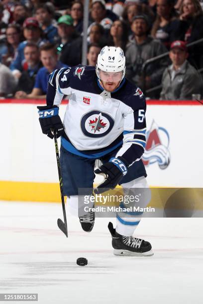 Dylan Samberg of the Winnipeg Jets skates against the Colorado Avalanche at Ball Arena on April 13, 2023 in Denver, Colorado.