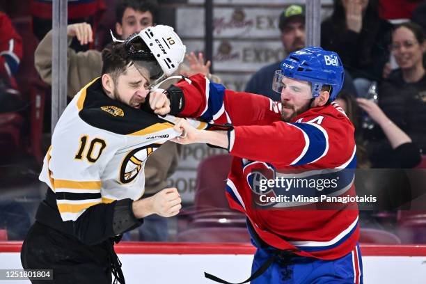 Greer of the Boston Bruins and Joel Armia of the Montreal Canadiens fight during the third period at Centre Bell on April 13, 2023 in Montreal,...