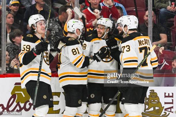 Boston Bruins right wing David Pastrnak celebrates his goal with his teammates during the Boston Bruins versus the Montreal Canadiens game on April...