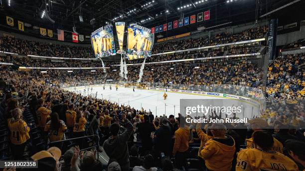 Nashville Predators fans celebrate a 4-3 overtime win against the Minnesota Wild during an NHL game at Bridgestone Arena on April 13, 2023 in...