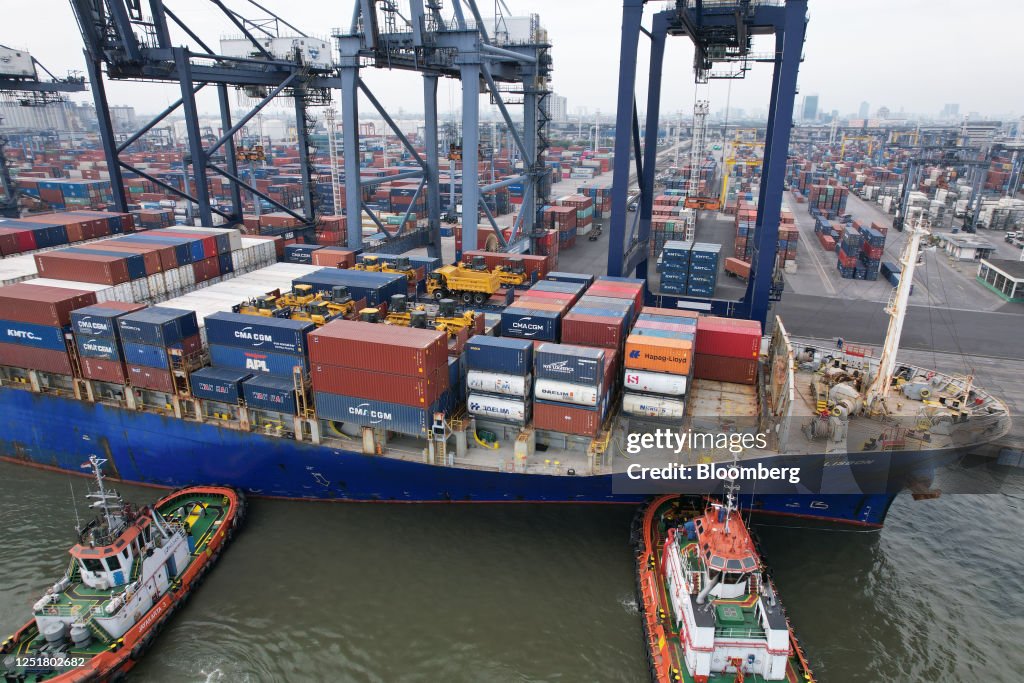 Container Tanjung Tug boats guides the Lisbon container ship into Tanjung Priok Port in ...