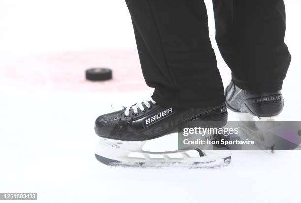 General view of the Bauer skates of a linesman and the puck is shown during the NHL game between the Nashville Predators and Minnesota Wild, held on...