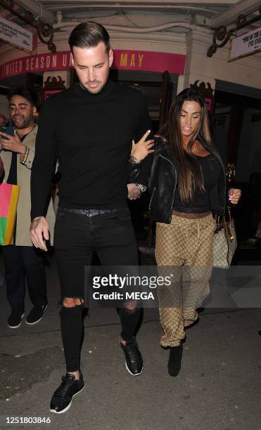 Carl Woods and Katie Price are seen leaving the Ambassadors theatre on April 13, 2023 in London, United Kingdom.