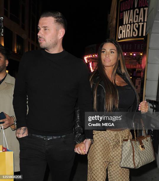 Carl Woods and Katie Price are seen leaving the Ambassadors theatre on April 13, 2023 in London, United Kingdom.