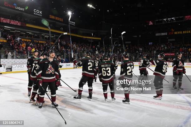 Players of the Arizona Coyotes salute the fans after a 5-4 overtime loss to the Vancouver Canucks in the final game of the season at Mullett Arena on...