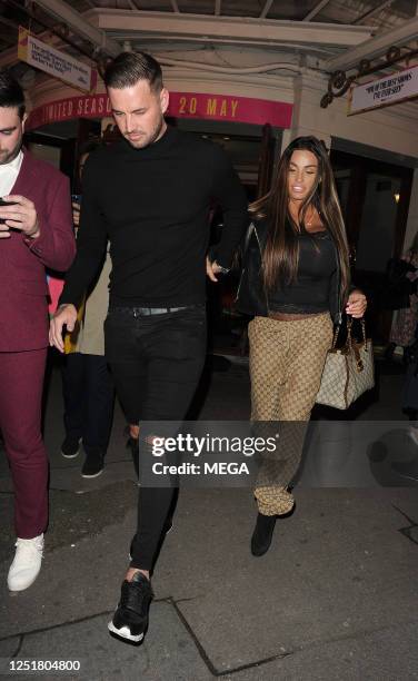 Carl Woods and Katie Price are seen leaving the Ambassadors theatre on April 13, 2023 in London, United Kingdom.