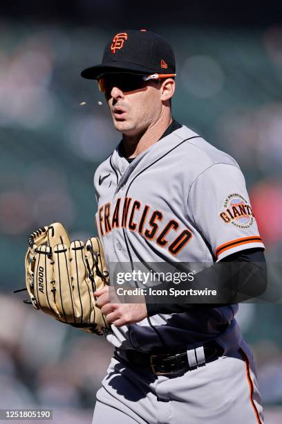 San Francisco Giants center fielder Mike Yastrzemski spits sunflower seeds as he heads to the dugout in between innings during an MLB game against...