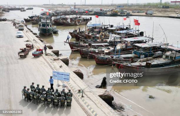 Police and Marine militia conduct coastal defense safety education at the fishing port of Dongying City, East China's Shandong Province, April 14,...