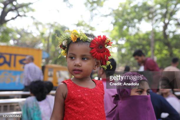 Bangladeshi child at the Bengali New Year's Day celebrations on April 14, 2023 in Dhaka, Bangladesh. Celebrating Bengali New Year is a traditional...