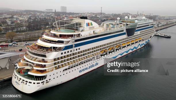 April 2023, Mecklenburg-Western Pomerania, Warnemünde: The "Aidadiva" has moored at the cruise terminal of the Baltic Sea resort. The ship opens this...