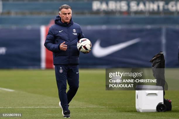 Paris Saint-Germain's French head coach Christophe Galtier attends a training session at the club's "Camp des Loges" training ground in...