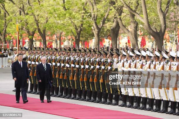 Chinese President Xi Jinping and Brazil's President Luiz Inacio Lula da Silva attend a welcome ceremony at the Great Hall of the People in Beijing on...