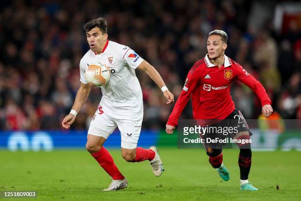 Marcos Acuna of Sevilla FC and Antony of Manchester United battle for the ball during the UEFA Europa League quarterfinal first leg match between...