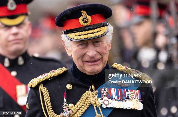 Britain's King Charles III inspects graduating officer cadets march during the 200th Sovereign's Parade at the Royal Military Academy, Sandhurst,...