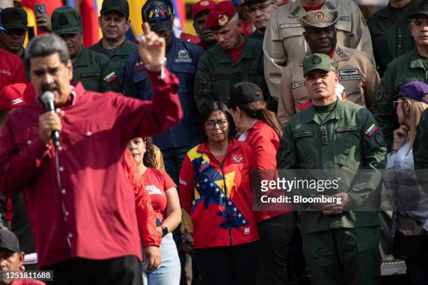 Delcy Rodriguez, Venezuela's vice president, center, and Vladimir Padrino Lopez, Venezuela's defense minister, right, on the anniversary of a failed...