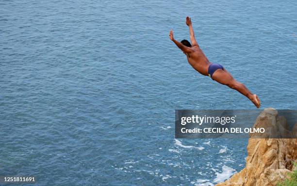Cliff diver jumps from "La Quebrada" cliff in Acapulco, Mexico, on September 30th, 2007. The tradition of "La Quebrada" goes back to 1934, when two...