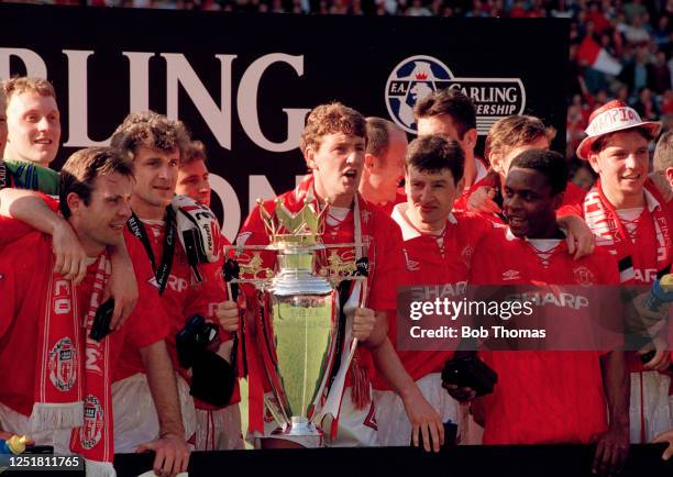 Manchester United line up for a group photo as they celebrate with the League trophy following the presentation after the FA Carling Premiership...