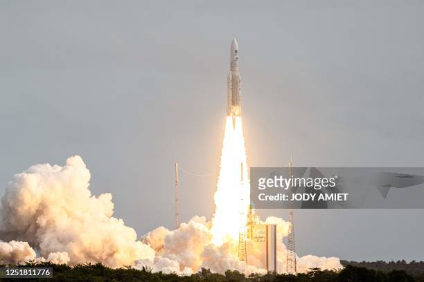 This photograph taken on April 14 shows Arianespace's Ariane 5 rocket lifting off from its launchpad, at the Guiana Space Center in Kourou, French...