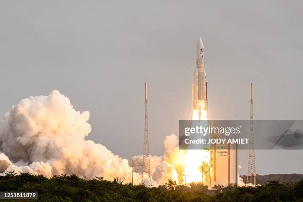 This photograph taken on April 14 shows Arianespace's Ariane 5 rocket lifting off from its launchpad, at the Guiana Space Center in Kourou, French...