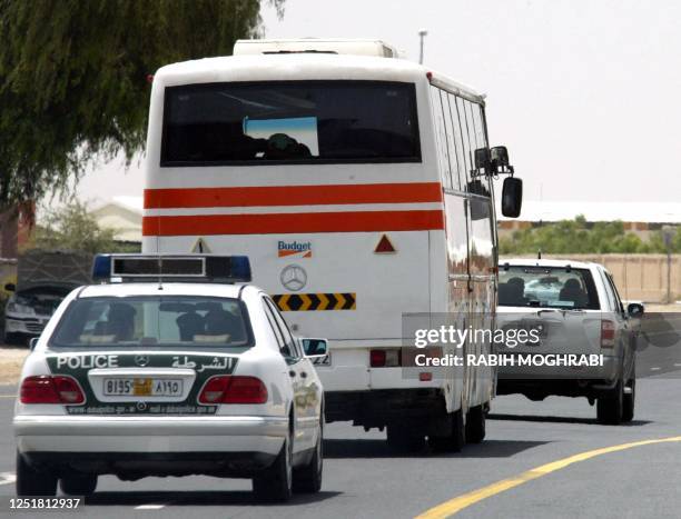 Bus carrying the English soccer team head to a training camp in Dubai 16 May 2002. The England's squad of the World Cup is in Dubai for a three-day...