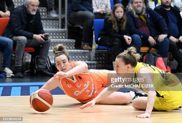 Schio's US guard Marina Mabrey and Fenerbahce's Hungarian point guard Courtney Vandersloot vie on the ground for the ball during the Euroleague...
