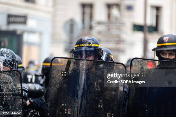 Police officer is seen covered with ink during the clashes with protesters. New wave of protests on the 12th day of the general strike over the...