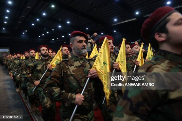 Militants with the Lebanese Shiite movement Hezbollah, parade in Beirut's southern suburbs on April 14 to mark Al-Quds Day, a commemoration in...