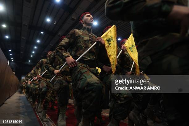 Militants with the Lebanese Shiite movement Hezbollah, parade in Beirut's southern suburbs on April 14 to mark Al-Quds Day, a commemoration in...