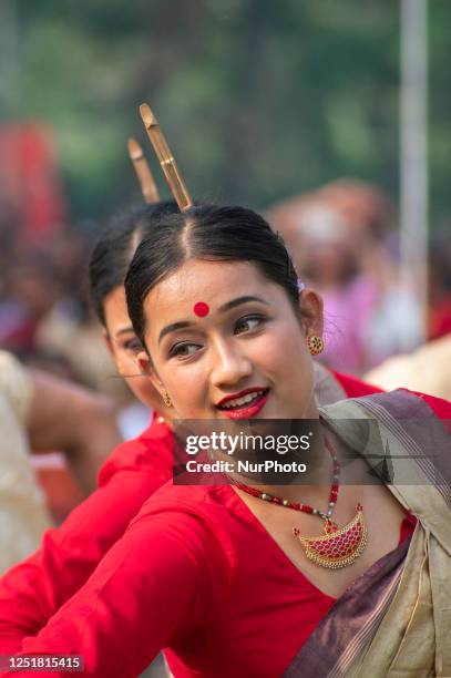 Young women in traditional Mekhela Chadar perform Bihu dance, as they celebrates Rongali Bihu festival organized by All Assam Students Union , at...