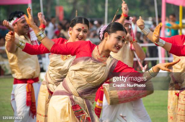 Young men and women in traditional Mekhela Chadar perform Bihu dance, as they celebrates Rongali Bihu festival organized by All Assam Students Union...