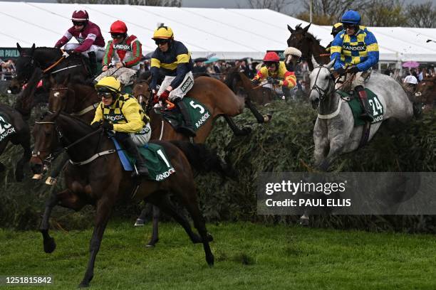 Jockey Sam Twiston-Davies and eventual winner 'Bill Baxter' jump The Chair during the Topham Handicap Chase, over the Grand National fences on the...