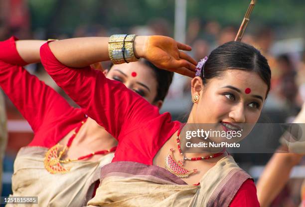 Young women in traditional Mekhela Chadar perform Bihu dance, as they celebrates Rongali Bihu festival organized by All Assam Students Union , at...