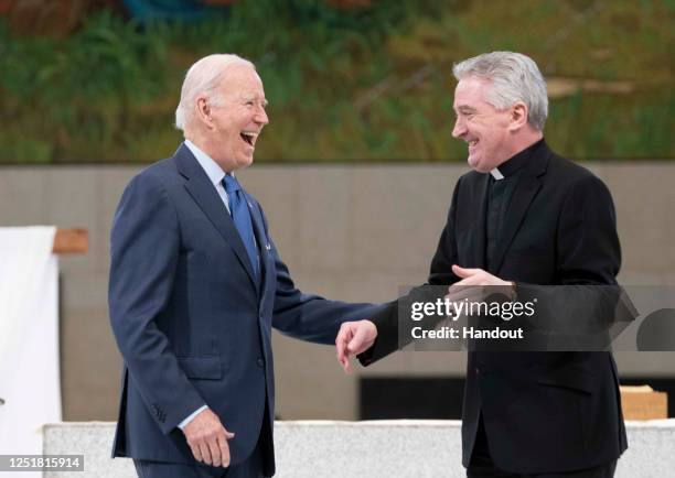 In this handout image provided by the Irish Government, US President Joe Biden visits Knock Shrine and Basilica with Fr. Richard Gibbons on April 14,...