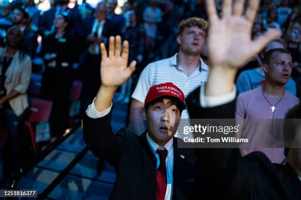 Guest sing before Florida Gov. Ron DeSantis spoke during a convocation at Liberty University's Vines Center in Lynchburg, Va., on Friday, April 14,...