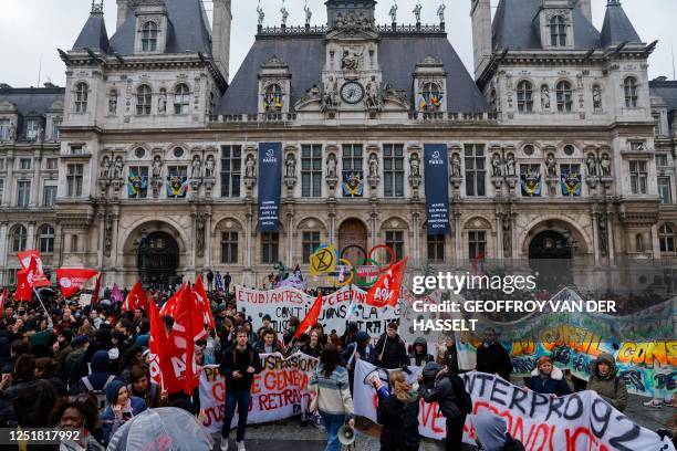 Protestors gather in front of the Hotel De Ville during a demonstration after the court approved the key elements on French President's unpopular...