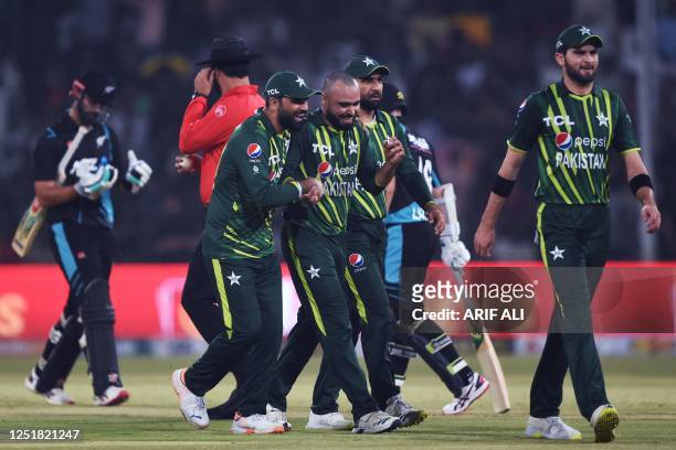 Pakistan's Faheem Ashraf celebrates with teammates after taking the wicket of New Zealand's Daryl Mitchell during the first Twenty20 cricket match...