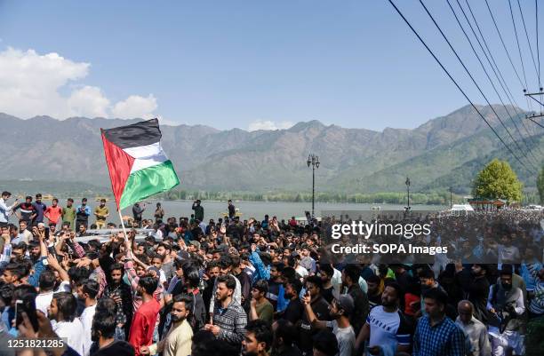 Kashmiri Muslims walk while chanting pro Palestinian slogans during a rally marking Quds day in Srinagar. Is the Arabic name For Jerusalem. An...