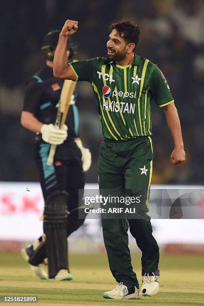 Pakistan's Haris Rauf celebrates after taking the wicket of New Zealand's Rachin Ravindra during the first Twenty20 cricket match between Pakistan...