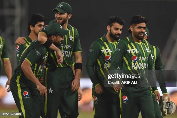 Pakistan's captain Babar Azam and teammates celebrate after winning the first Twenty20 cricket match between Pakistan and New Zealand at the Gaddafi...